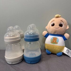 4 gently used MAM anti colic baby bottles (sz 1 nipple) and cocomelon plush